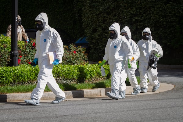 The 265th Infectious Control GA Army National Guard enters the Canterbury Court, a senior living facility in Buckhead, to disinfect the building on Friday, April 10, 2020. (STEVE SCHAEFER / Special to the AJC)