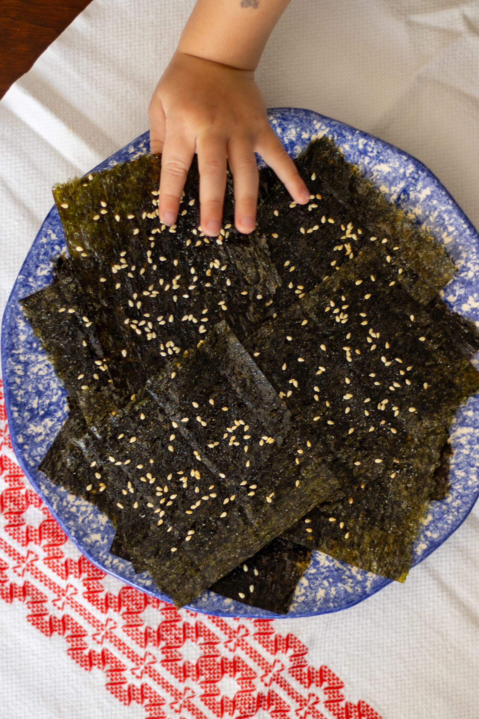 You might want to warn the kids that Sesame Seaweed Snacks won't come out of the oven quickly. (Kate Williams for The Atlanta Journal-Constitution)