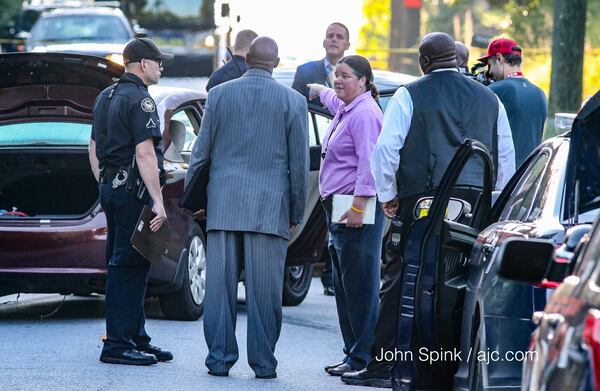 Authorities are investigating a shooting that involves three scenes, including this one on Peyton Road in Atlanta. JOHN SPINK / JSPINK@AJC.COM