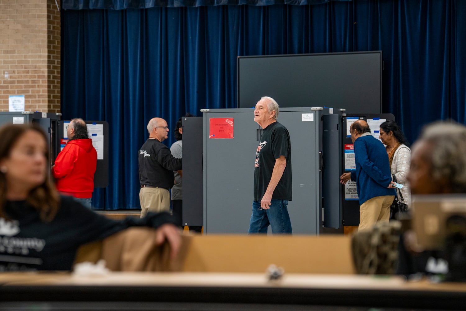 Poll workers chat while people vote at a polling site in Chamblee on election day  Tuesday, Nov. 5, 2024. (Olivia Bowdoin for the AJC). 