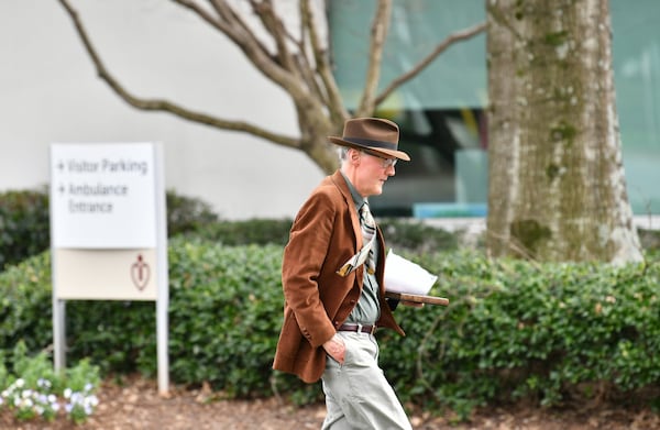 Steve Harben near the Northside Gwinnett Extended Care Center in Lawrenceville, where his mother lives. His daily visits have been restricted since the facility suspended access for family members to protect residents from the coronavirus. (Hyosub Shin / Hyosub.Shin@ajc.com)