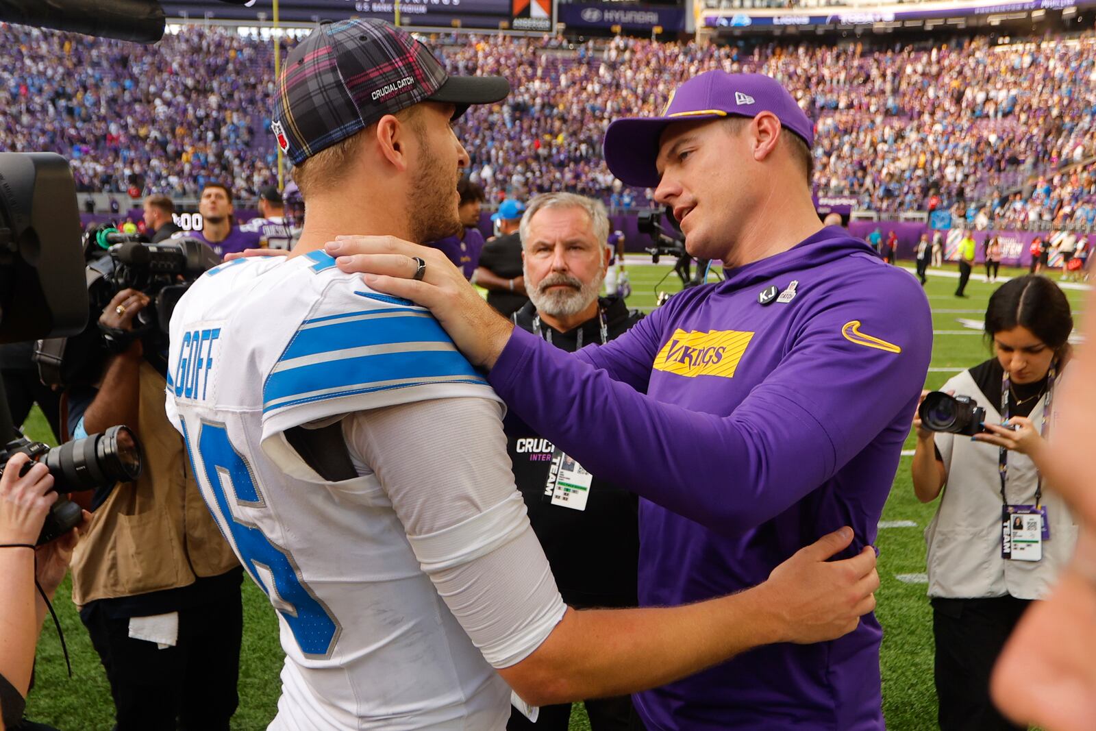 Detroit Lions quarterback Jared Goff (16) talks with Minnesota Vikings head coach Kevin O'Connell after an NFL football game Sunday, Oct. 20, 2024, in Minneapolis. (AP Photo/Bruce Kluckhohn)