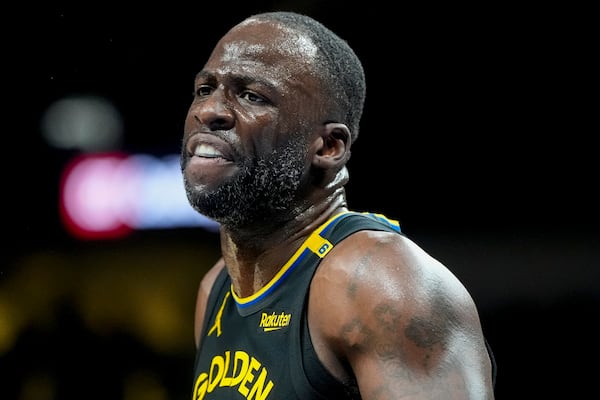 Golden State Warriors forward Draymond Green (23) speaks to an official during the first half of an NBA basketball game against the Atlanta Hawks, Saturday, March 22, 2025, in Atlanta. (AP Photo/Mike Stewart)