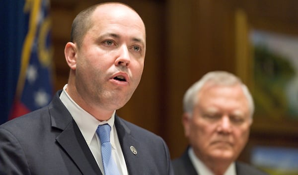 October 12, 2016, Atlanta - Chris Carr, left, address reporters with Governor Nathan Deal, right, during a press conference where Carr was appointed the next Attorney General following the Board of Regents vote to hire current Attorney General Sam Olens as president of Kennesaw State University in Atlanta, on Wednesday, October 12, 2016. Carr will take his new position on November 1.(DAVID BARNES / DAVID.BARNES@AJC.COM)