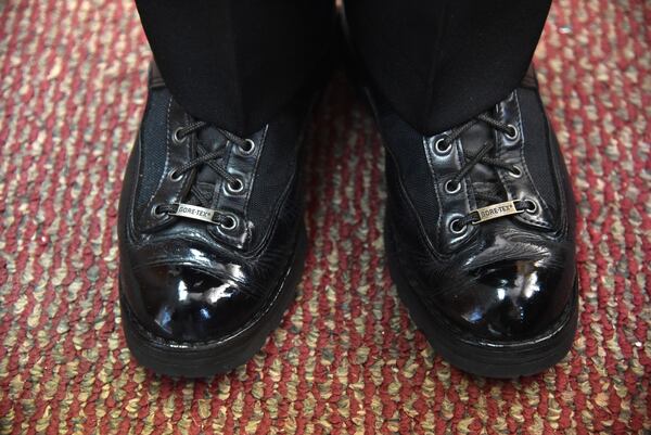 Longtime customer Brian Venable, a Cherokee County sheriff's deputy, wears shoes Billy Moss repaired. Venable, an avid leatherworker, said of Moss's handiwork, “I was always fascinated with the craftsmanship. Having my hands deep into it, I know what it takes to be able to do it. Not everybody can do it.” (Hyosub Shin / Hyosub.Shin@ajc.com)