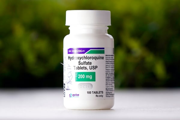 FILE - This Tuesday, April 7, 2020 file photo shows a bottle of hydroxychloroquine tablets in Texas City, Texas. On Friday, April 24, 2020, the U.S. Food and Drug Administration warned doctors against prescribing the malaria drug to treat COVID-19 outside of hospitals or research settings. (AP Photo/David J. Phillip)