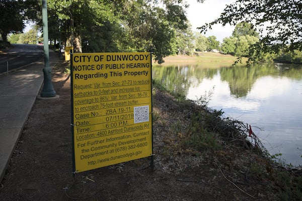  An informative sign is posted near a pond along Ashford Parkway, in Dunwoody. (Alyssa Pointer/alyssa.pointer@ajc.com)