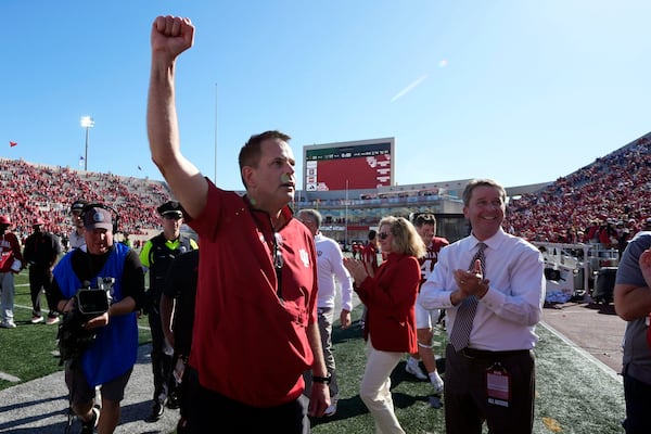 Indiana head coach Curt Cignetti celebrates as he leaves the field following an NCAA college football game against Washington, Saturday, Oct. 26, 2024, in Bloomington, Ind. (AP Photo/Darron Cummings)