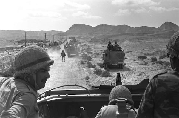 FILE - In this photo released by the Government Press Office, Israeli troops advance towards Egyptian position in the southern Sinai during the Six Day War, June 1967. (AP Photo/Government Press Office, File)