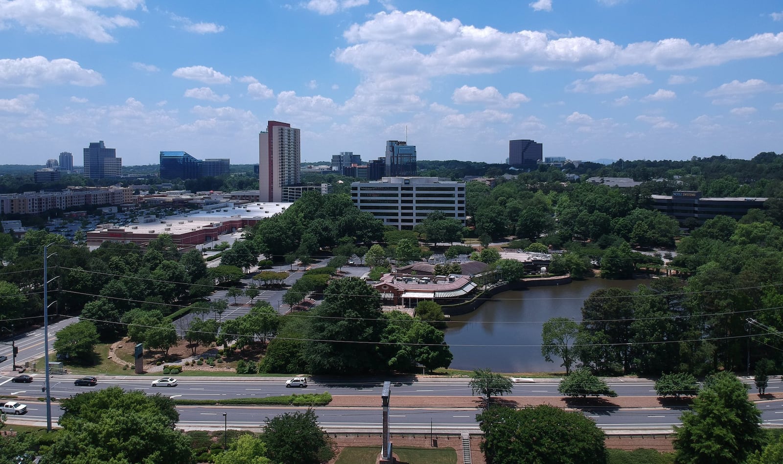 Developer plans to build a mixed-use shopping center in this space. The plan involves paving over a pond. HYOSUB SHIN / HSHIN@AJC.COM