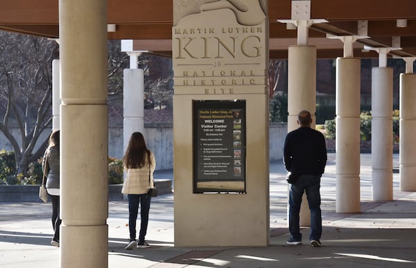 Visitors walk around the Martin Luther King Jr. National Historical Park in Atlanta on Dec. 22, 2018, shortly before a partial federal government shutdown closed the park for most of January 2019. HYOSUB SHIN / HSHIN@AJC.COM