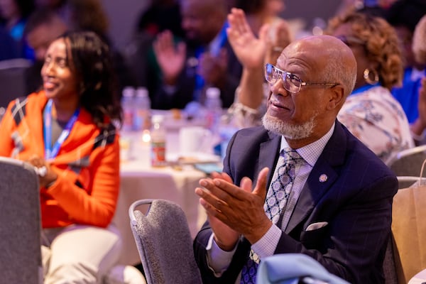 Former state representative Calvin Smyre, who has attended 12 national conventions, claps at the Georgia delegation breakfast at the Hyatt Regency in Chicago on Monday, August 19, 2024, the first day of the Democratic National Convention. (Arvin Temkar / AJC)