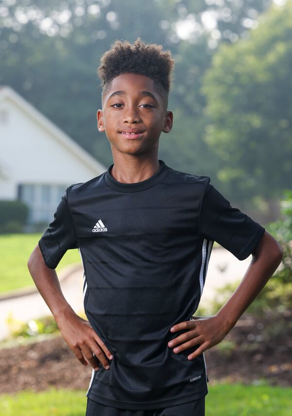 Nine-year-old Carter Blackmon in his front yard, Thursday, June 29, 2023, in Roswell, Ga. Carter will be competing for the first time in the Peachtree Junior on Sunday, July 2. Jason Getz / Jason.Getz@ajc.com)