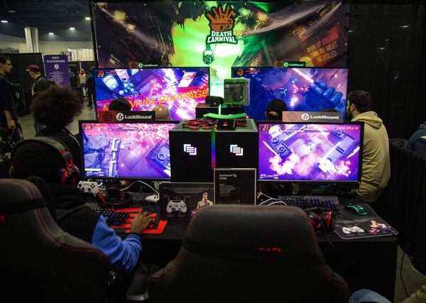 People play Death Carnival during DreamHack Atlanta at the Georgia World Congress Center. STEVE SCHAEFER / SPECIAL TO THE AJC