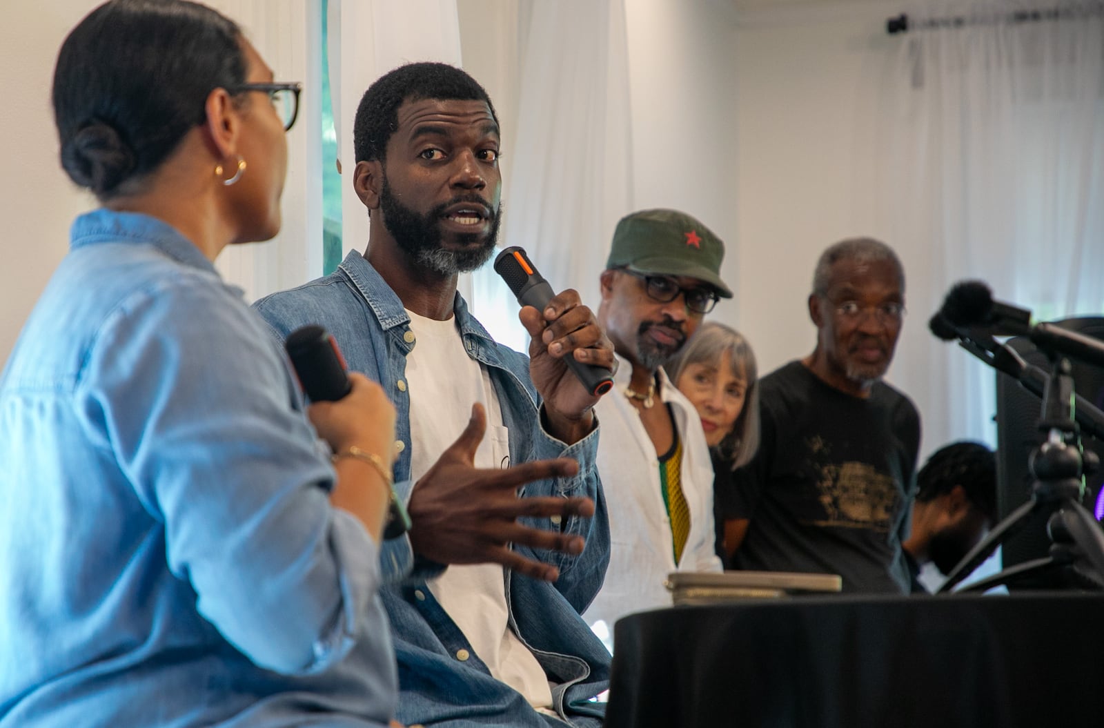 Nasim Fluker of The Tenth interviews Stephen Satterfield, host of the Netflix series "High on the Hog," during a Soulfood Sunday salon event held August 25, 2024, at Hammonds House Museum.