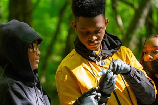 Youth participating in science-related activities sponsored by Newman Wetlands Center