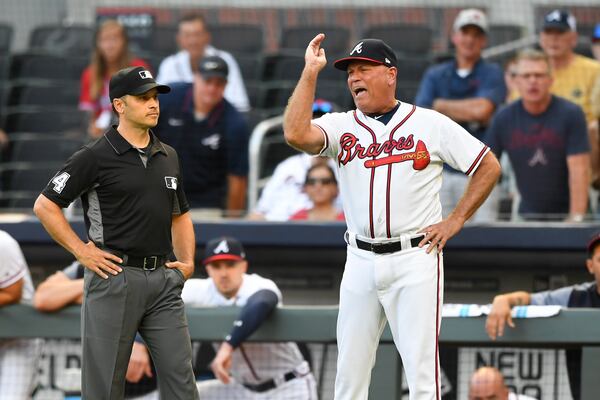 Braves manager Brian Snitker argues with umpire Mark Wegner after being ejected in the first inning. (AP Photo/John Amis)