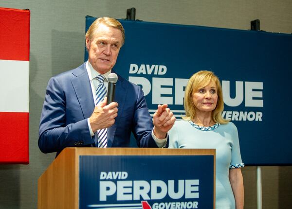 David Perdue conceads the primary Republican Govenor' race to Brian Kemp, with his wife Bonnie Perdue at his side, during his election party on Tueday, May 24, 2022.  (Jenni Girtman for The Atlanta Journal-Constitution)