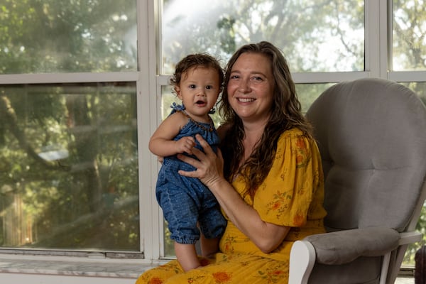 Mandi Rokx of Melrose, Florida, was cut from Medicaid three months after delivering her daughter, Vernita, in February. An unknown number of Florida mothers have been disenrolled from Medicaid despite being eligible for 12 months of continuous coverage. (David Steele for KFF Health News)
 
