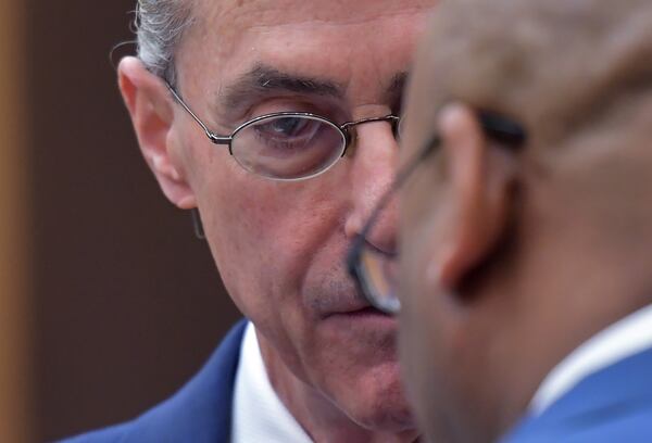 March 20, 2018 Atlanta - Defense attorney Bruce Harvey (left) and Fulton County Chief Assistant District Attorney Clint Rucker confer during the 6th day of trial for Tex McIver before Fulton County Chief Judge Robert McBurney on Tuesday, March 20, 2018. HYOSUB SHIN / HSHIN@AJC.COM