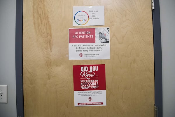 Placards warning patients of signs of coronavirus are displayed at the American Family Care clinic located inside the Piedmont West Outpatient Center in Atlanta during a visit on Tuesday, March 3, 2020. (PHOTO by ALYSSA POINTER/ALYSSA.POINTER@AJC.COM)