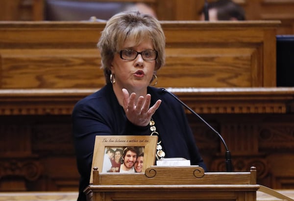 Sen. Renee Unterman, R-Buford, has sponsored several bills to address the opioid crisis in Georgia. On the lectern in front of her is a photo of an opiod victim. BOB ANDRES /BANDRES@AJC.COM