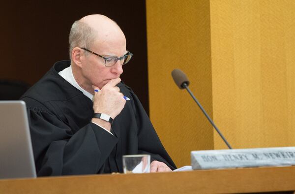 Fulton County Superior Court Judge Henry Newkirk listens to attorney Brian Steel argue to have the case dismissed on Day 4 of the trial at the Fulton County Courthouse on April 6, 2018. STEVE SCHAEFER / SPECIAL TO THE AJC