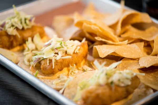  Fried Fish Tacos, three fried cod tacos served on fresh corn tortillas with house slaw and house-made sriracha. Photo credit- Mia Yakel.