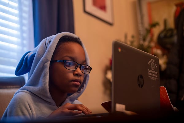 10/12/2020 - Hampton, Georgia - Cayden Dahn, 11, participates in virtual learning at Eddie White Academy at her familyÕs residence in Hampton, Monday, October 12, 2020.  (Alyssa Pointer / Alyssa.Pointer@ajc.com)