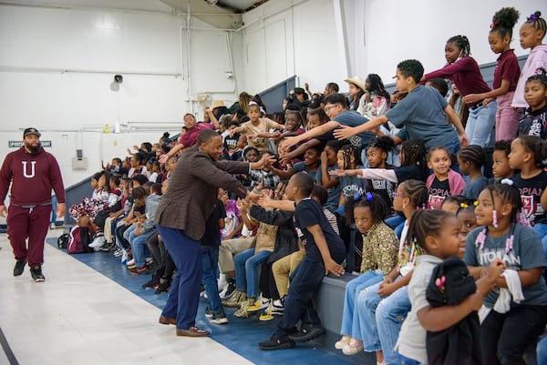 Artesius Miller attends a pep rally at the elementary school.  Jamie Spaar For the AJC