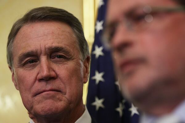 U.S. Sen. David Perdue, R-Ga., (left) in a 2017 file photo. Alex Wong/Getty Images