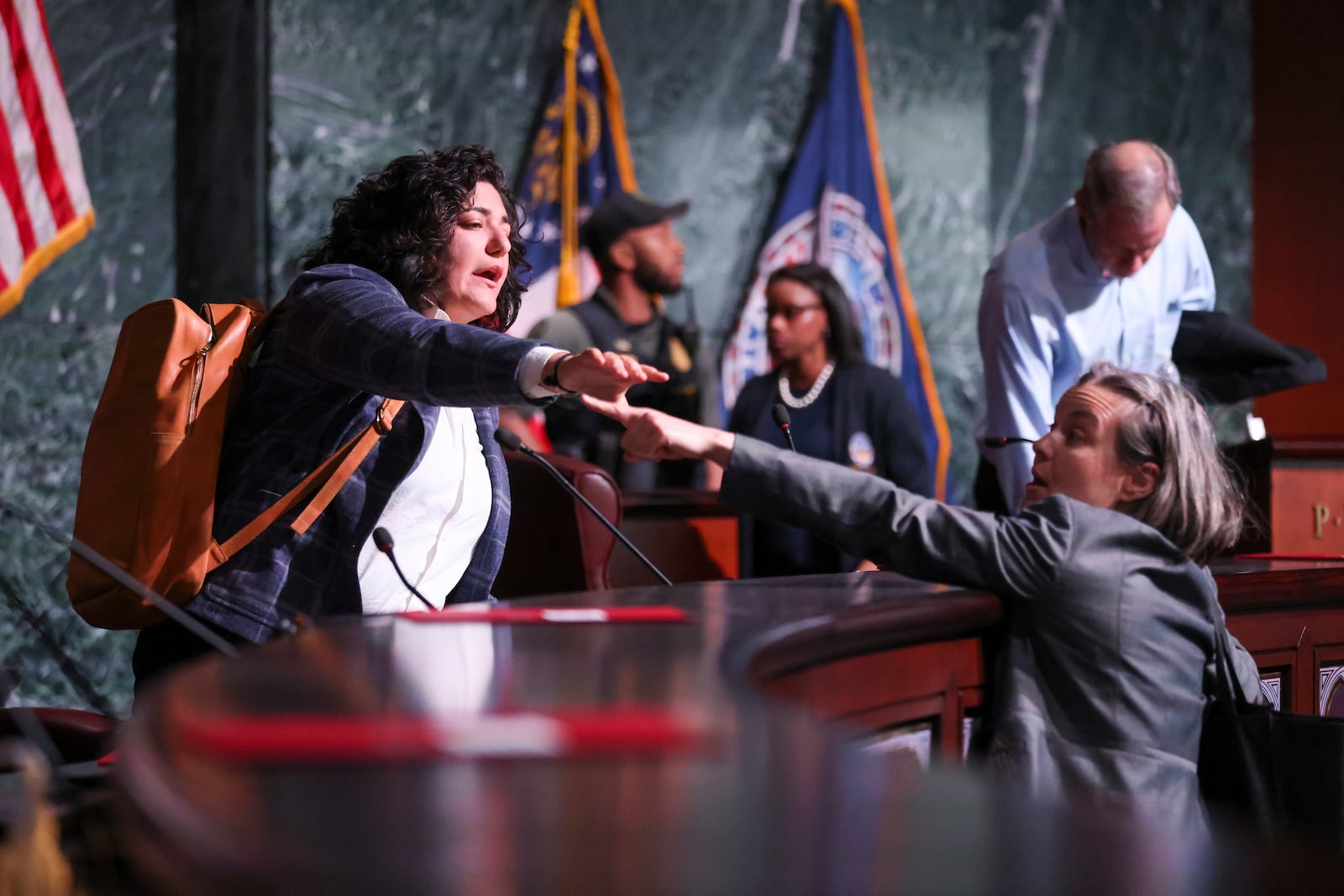 Atlanta City Council member Liliana Bakhtiari reacts as a protestor comes into the chambers after the council members voted 11 to 4 to approve legislation to fund the training center, on Tuesday, June 6, 2023. Bakhtiari voted against the funding. (Jason Getz/The Atlanta Journal-Constitution)