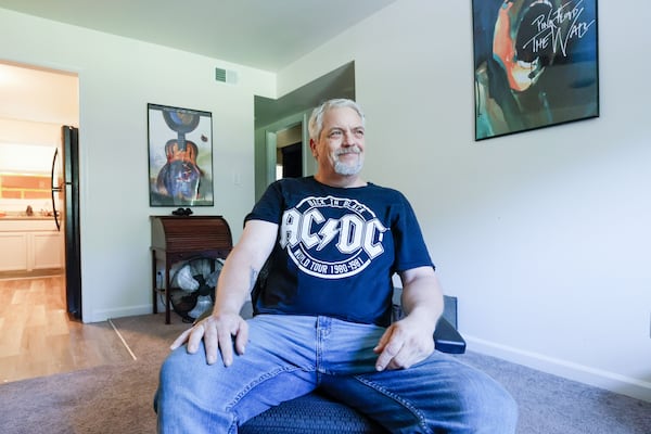 Pacia Mobley is now in a southwest Atlanta apartment. After two years unhoused, he was enjoying the privacy, bath and air conditioning in his brick apartment building. (Miguel Martinez / AJC)

