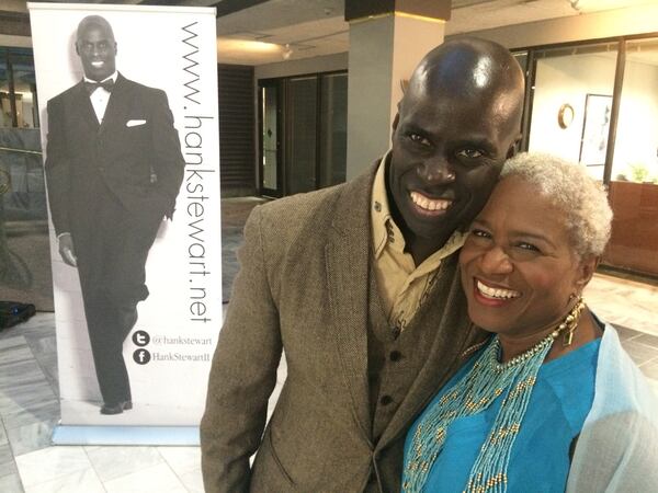 Poet Hank Stewart, shown with with longtime local broadcaster Monica Pearson at an event last month to honor Stewart, penned an ode to President Barack Obama called “44.” JENNIFER BRETT / JBRETT@AJC.COM