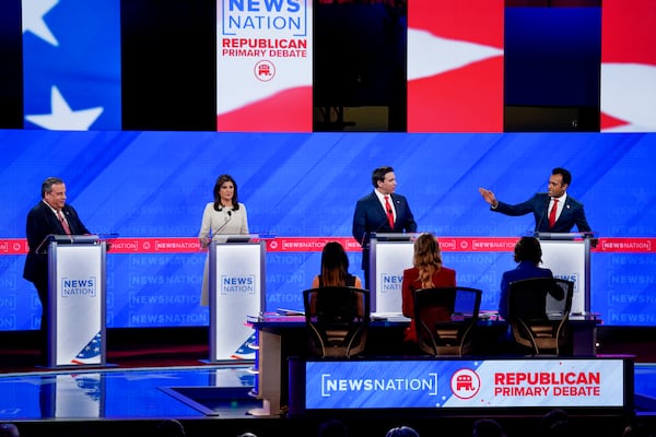 
                        Entrepreneur Vivek Ramaswamy speaks as former Gov. Chris Christie of New Jersey, Gov. of Florida Ron DeSantis, and former Gov. Nikki Haley of South Carolina listen during the fourth Republican presidential primary debate at the University of Alabama in Tuscaloosa, Ala., on Wednesday, Dec. 6, 2023. (Nicole Craine/The New York Times)
                      