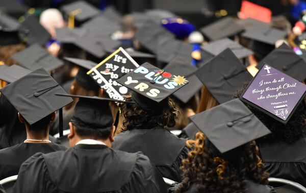 April Lewis, 64, wears her mortarboard that says “40 PLUS YRS” during fall 2017 commencement exercises on Tuesday, Dec. 12, 2017 at Georgia State University’s Perimeter campus. Lewis, 64, and her sister Mae Brown, 67, began their college careers in the 1970s, but it’s taken them a few years to graduate. Their studies were interrupted by jobs, childbirths, family illnesses, etc. HYOSUB SHIN / HSHIN@AJC.COM