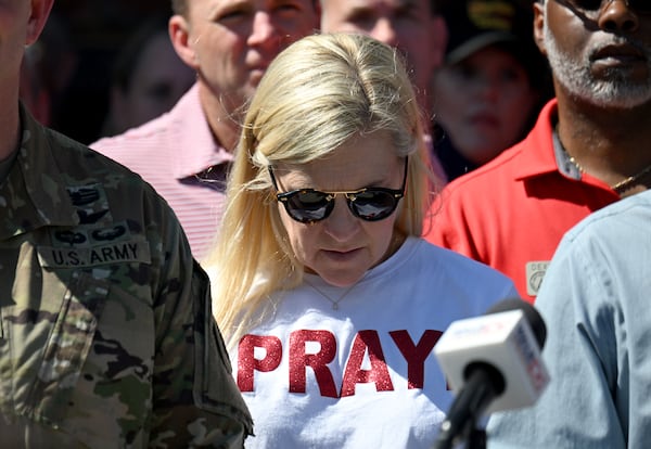 Georgia's first lady Marty Kemp wears a T-shirt that reads “Pray” as Gov. Brian Kemp (not pictured) speaks at Lowndes County Emergency Management Operations Center on Saturday, Sept. 28, 2024, in Valdosta. Damaging Helene has swept through Georgia, leading to at least 15 deaths. All 159 counties are now assessing the devastation and working to rebuild, even as serious flooding risks linger. (Hyosub Shin/AJC)