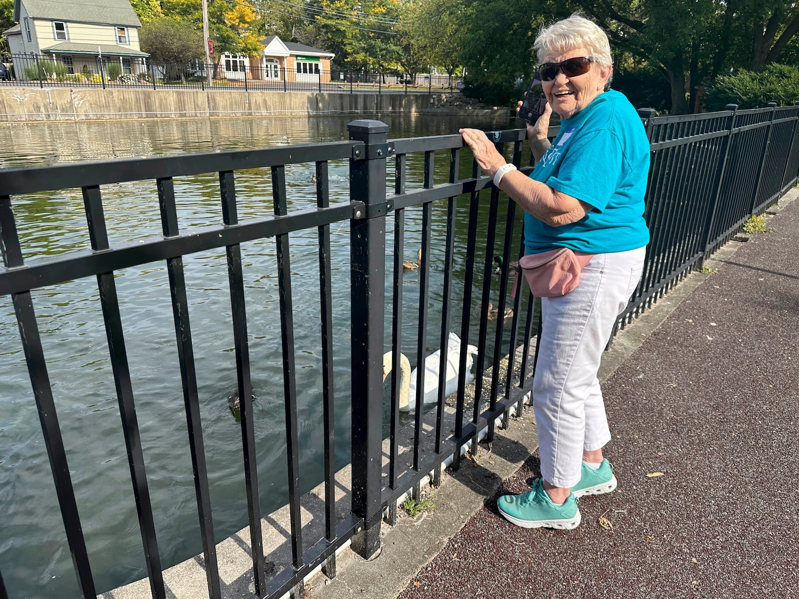 Martha Ballard Lacy, 89, of Manlius, N.Y., pauses on one of her daily walks at Manlius Swan Pond, in Manlius, N.Y., Sept. 17, 2024 (AP Photo/Carolyn Thompson)