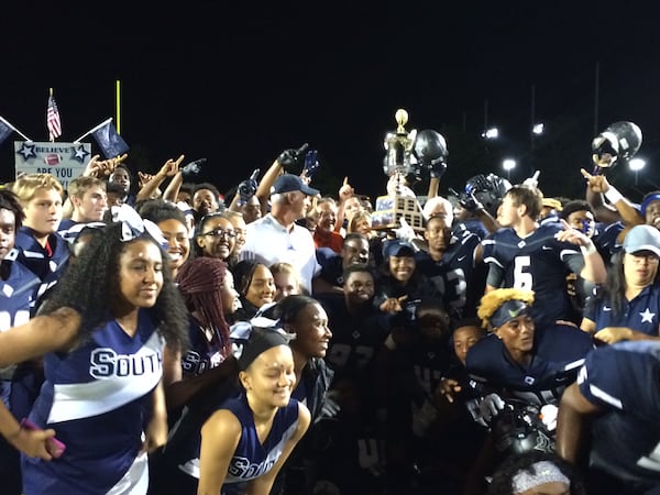 South Gwinnett celebrates with the Mayor's Trophy for winning the Battle of Snellville