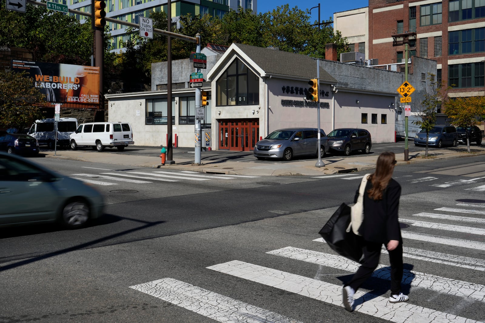 A pedestrian walks near the Chinese Christian Church and Center, Thursday, Oct. 10, 2024, in Philadelphia. (AP Photo/Matt Slocum)