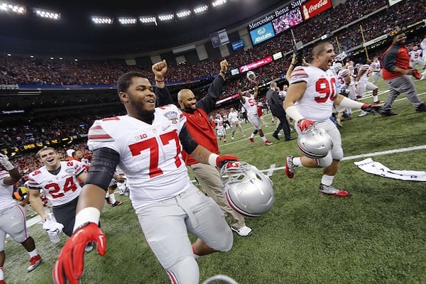 Ohio State players take the field after the Sugar Bowl NCAA college football playoff semifinal game Alabama, Thursday, Jan. 1, 2015, in New Orleans. Ohio State won 42-35. (AP Photo/Bill Haber) The thrill of victory. (Bill Haber/AP photo)