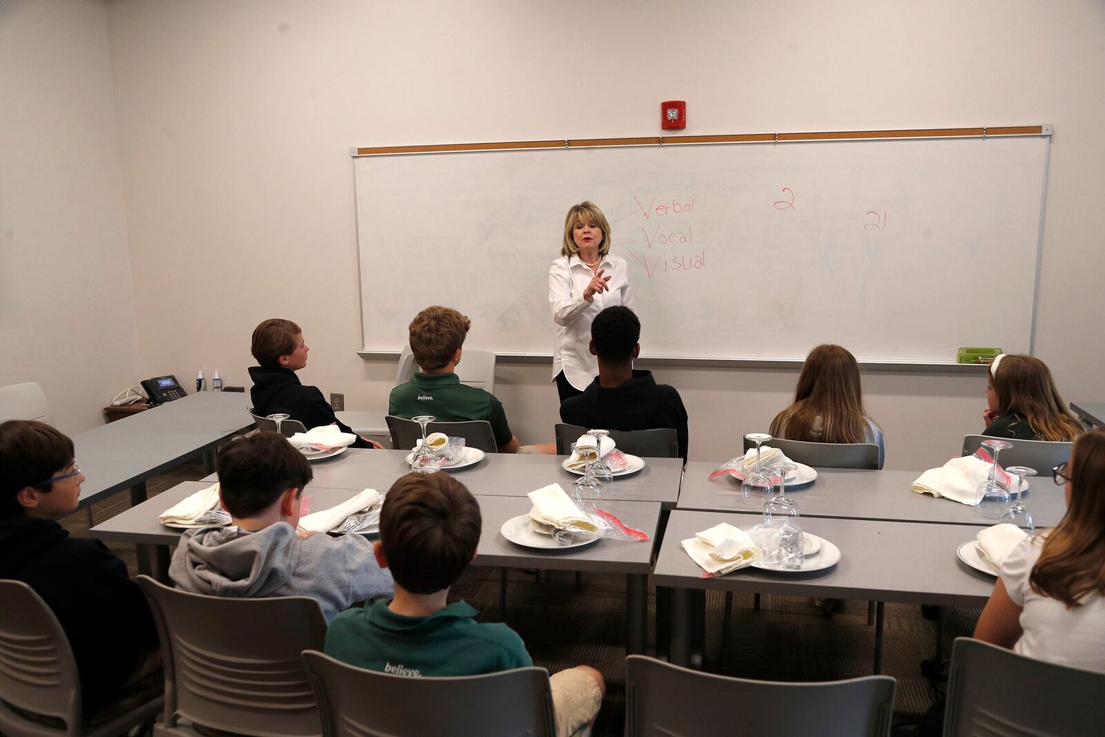 Janis Encapera talks etiquette with a group of students at Blessed Sacrament School on Monday April 17, 2023.