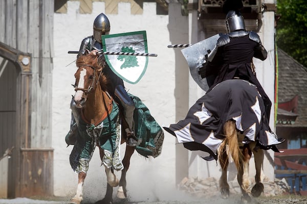 Horseback riders compete during the jousting demonstration during the Georgia Renaissance Festival in Fairburn. STEVE SCHAEFER / SPECIAL TO THE AJC