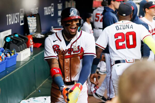 Braves right fielder Ronald Acuna Jr. (13) reacts at the dugout after scoring a run during the first inning against the Miami Marlins at Truist Park, Tuesday, April 25, 2023, in Atlanta. 




Miguel Martinez / miguel.martinezjimenez@ajc.com 