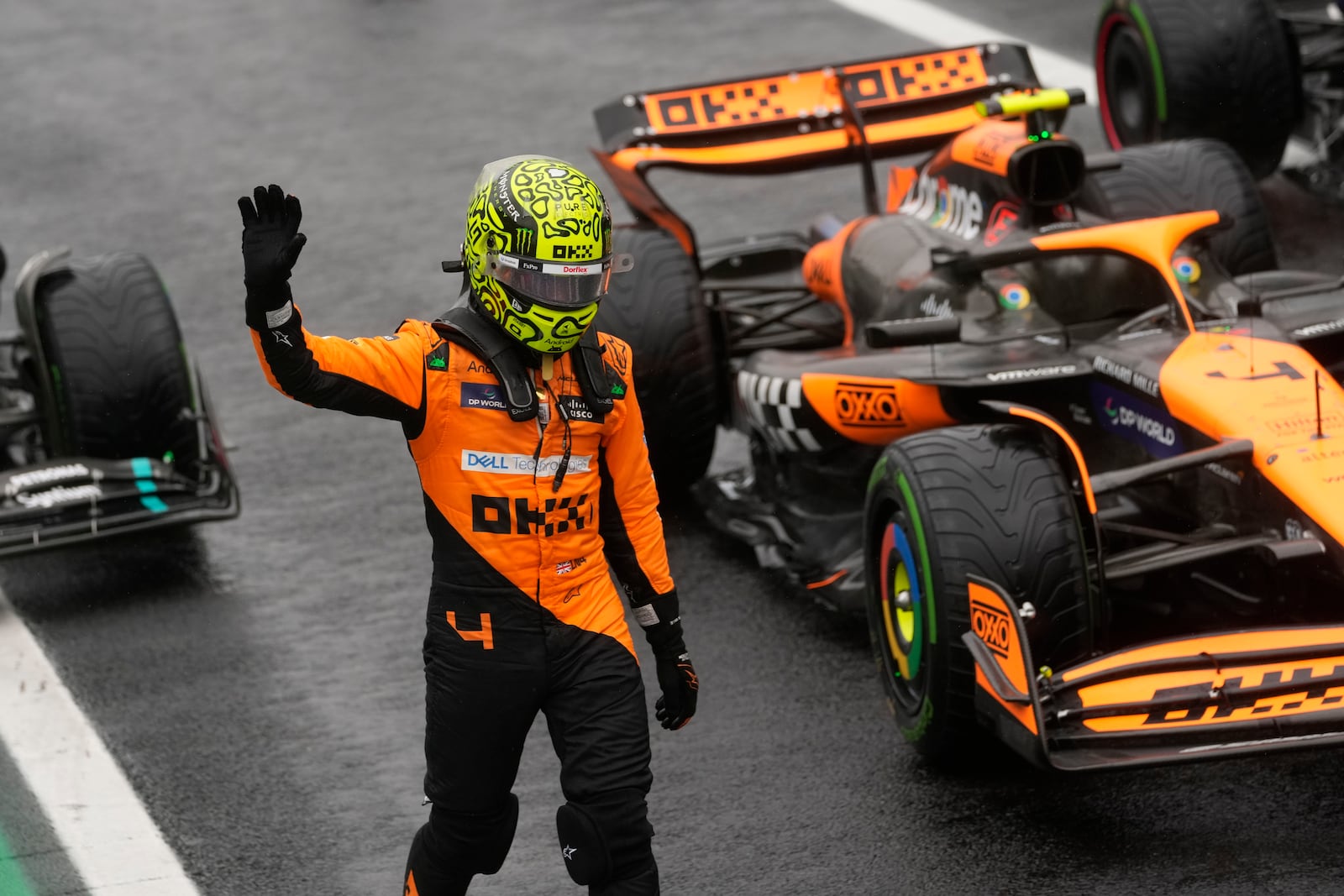 Pole position winner, McLaren driver Lando Norris of Britain, celebrates after the qualifying session ahead of the Brazilian Formula One Grand Prix at the Interlagos race track, in Sao Paulo, Brazil, Sunday, Nov. 3, 2024. (AP Photo/Andre Penner)