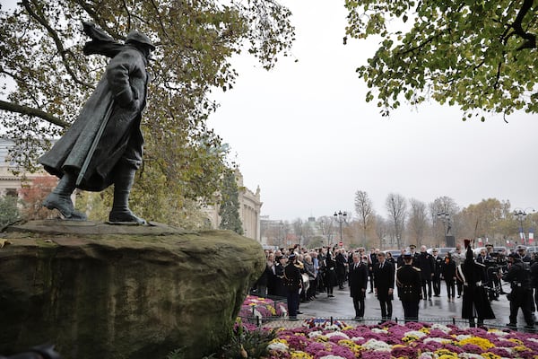 French President Emmanuel Macron and British Prime Minister Keir Starmer attend a wreath-laying ceremony in front of the statue of Georges Clemenceau near the Champs Elysees avenue, during commemorations marking the 106th anniversary of the WWI Armistice, in Paris, France, Monday, Nov.11 2024. (Christophe Petit Tesson, Pool via AP)