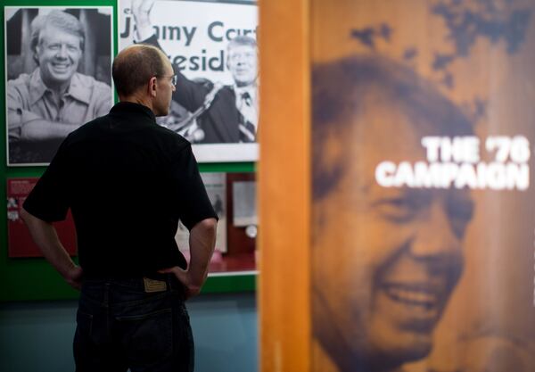 FILE ART: Scott Rasmussen watches a video in the museum at the Carter Presidential Library in Atlanta. BRANDEN CAMP / SPECIAL