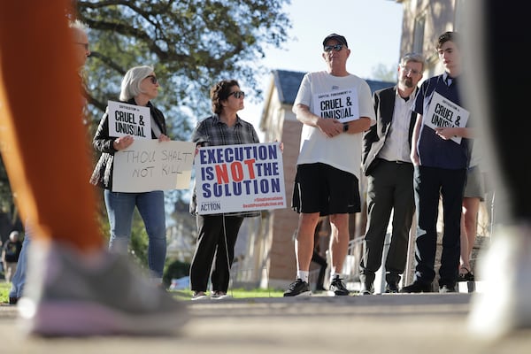 People gather in front of First Grace United Methodist Church in New Orleans for a prayer vigil in opposition to the execution of Jessie Hoffman Jr., Tuesday, March 18, 2025. (Brett Duke/The Times-Picayune/The New Orleans Advocate via AP)