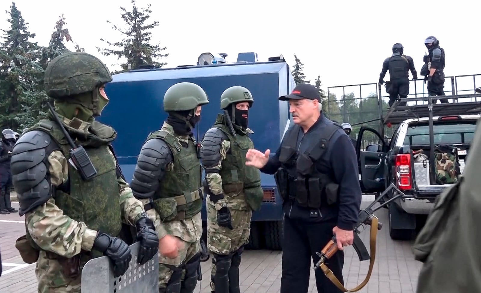 FILE - In this image made from video provided by the State TV and Radio Company of Belarus, President Alexander Lukashenko greets riot police near the Palace of Independence in Minsk, Belarus, amid street protests on Aug. 23, 2020. (State TV and Radio Company of Belarus via AP, File)