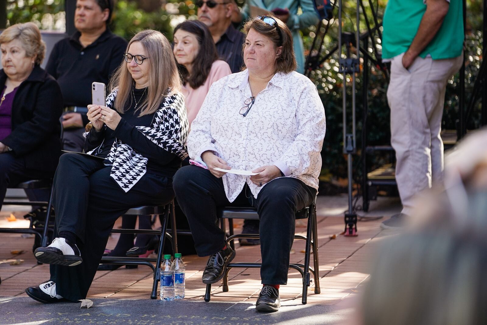 Dana Jewell, wife of Richard Jewell, listens to a speaker during a dedication ceremony honoring Mr. Jewell and first responders at Centennial Olympic Park, on Wednesday, November 10, 2021, in Atlanta. (Elijah Nouvelage for The Atlanta Journal-Constitution)